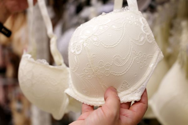 woman holding a white bra