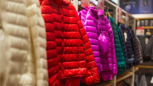 Dropshipping Clothing Business Name Ideas - Puffy jackets displayed in a store