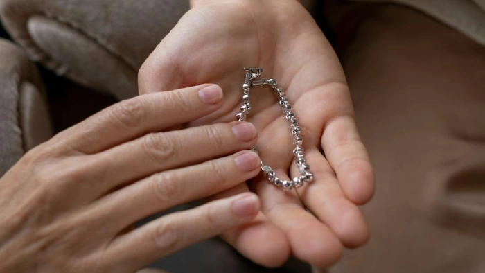 Dropshipping Love Bracelets Business Name Ideas - a bracelet on someone's palm